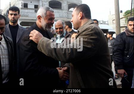 Palestinian Prime Minister in Gaza Strip, Ismail Haneiyah greets the top Hamas armed commander Ayman Nofal upon his arrival to his home in Nusairat refugee camp File: Palestinian Prime Minister in Gaza Strip, Ismail Haneiyah greets the top Hamas armed commander Ayman Nofal upon his arrival to his home in Nusairat refugee camp in the Central Gaza strip, Sunday, Feb. 6, 2011. The Palestinian militant group Hamas says one of its members has escaped from a prison in Egypt where he was accused of plotting bomb attacks. Ayman Nofal escaped last week during the anti-government unrest gripping Egypt Stock Photo