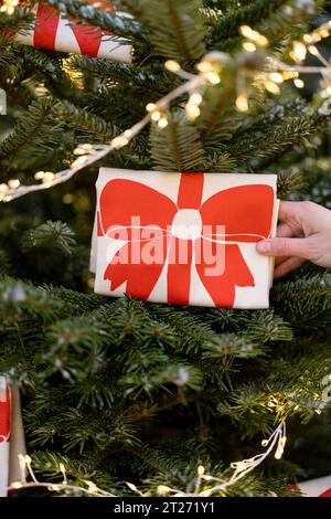 Decorates Christmas tree with big red bows Stock Photo
