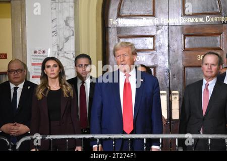 Manhattan, United States. 17th Oct, 2023. Former US President Donald J. Trump stands with his team that is representing him in court, for the civil fraud trial. Former US President Donald J. Trump attends his civil fraud trial in Manhattan, New York, United States on October 17, 2023. Former US President Donald J. Trump spoke to the media pool in the hallway of the courthouse prior to the start of the civil fraud trial Tuesday morning in New York City. Credit: SOPA Images Limited/Alamy Live News Stock Photo