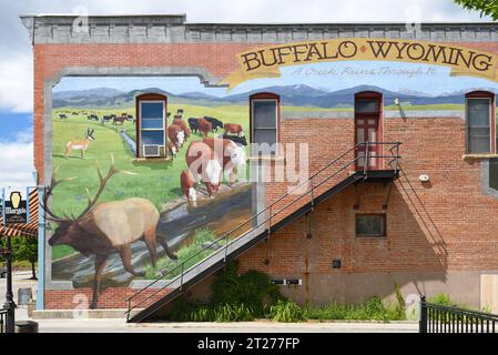 BUFFALO, WYOMING - JUNE 23, 2017: Mural on building on Main Street Shop. Buffalo's main street has more than a dozen historic buildings. Stock Photo