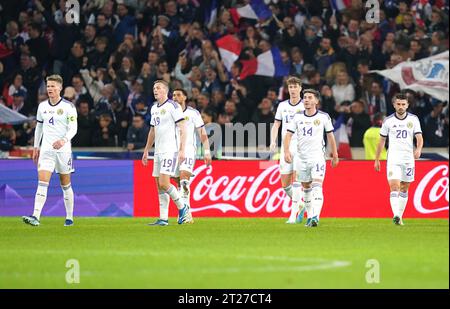 Scotland players look frustrated after France's Benjamin Pavard (not pictured) scores their side's first goal of the game during the international friendly match at the Stade Pierre Mauroy in Lille, France. Picture date: Tuesday October 17, 2023. Stock Photo
