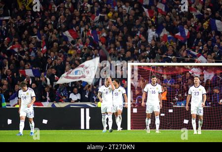 Scotland players look frustrated after France's Benjamin Pavard (not pictured) scores their side's second goal of the game during the international friendly match at the Stade Pierre Mauroy in Lille, France. Picture date: Tuesday October 17, 2023. Stock Photo