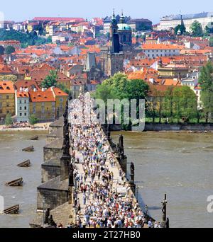 PRAGUE, CZECH REPUBLIC- JUNE 14, 2022: view of the Lesser Bridge Tower of Charles Bridge (Karluv Most) and Prague Castle Stock Photo