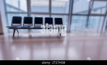 bench with five blue seats for a waiting room furniture concept Stock Photo