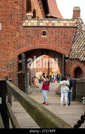 Tourists at the footbridge gate in Malbork Castle, Malbork, Poland, Europe, EU Stock Photo