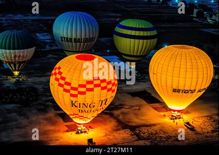 Hot Air Balloons preparing for early morning Lift off in Luxor Stock Photo