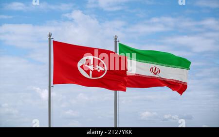 PFLP or Popular Front for the Liberation of Palestine and Iran flags waving together in the wind Stock Photo