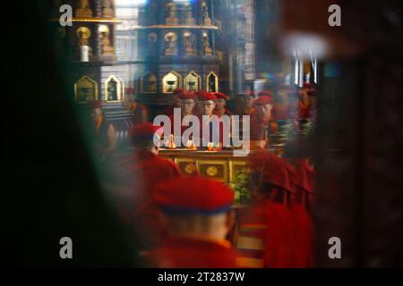 Ramkot, Nepal. 18th Aug, 2023. Kung Fu Nuns perform prayers at the main temple inside Druk Amitabha Mountain monastery on the outskirts of Kathmandu. The nuns start their day at 3am with two hours of prayer and meditation. (Credit Image: © Skanda Gautam/ZUMA Press Wire) EDITORIAL USAGE ONLY! Not for Commercial USAGE! Stock Photo