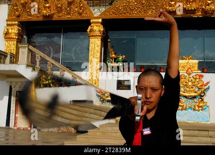 Ramkot, Nepal. 18th Aug, 2023. Central to the nuns' identity is their proficiency in martial arts. JIGME RUPA (all nuns' names are prefixed with Jigme) uses a sword to practice her skills outside the main temple. Among the eight 'mystical' weapons that can be used in martial arts, Rupa says her favorite is a sword. (Credit Image: © Skanda Gautam/ZUMA Press Wire) EDITORIAL USAGE ONLY! Not for Commercial USAGE! Stock Photo