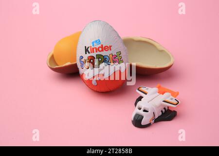 Sveti Vlas, Bulgaria - June 30, 2023: Kinder Surprise Eggs, plastic capsule and toy on pink background Stock Photo