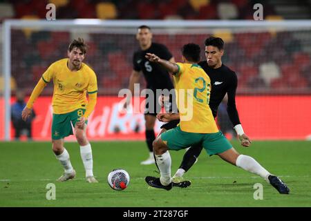 London, UK. 17th Oct, 2023. Marko Stamenic of New Zealand Men's National Team passing the ball under pressure during the International friendly match between Australia and New Zealand at Gtech Community Stadium, London, England on 17 October 2023. Photo by Carlton Myrie. Editorial use only, license required for commercial use. No use in betting, games or a single club/league/player publications. Credit: UK Sports Pics Ltd/Alamy Live News Stock Photo