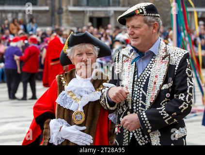 A civic dignatory and a perky king at the Pearly Kings and Queens Harvest Festival at Guildhall Yard, London, England. Stock Photo