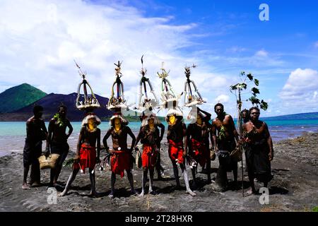 Masked Dancers in Rabaul posing with Spectators in Front of Mount ...