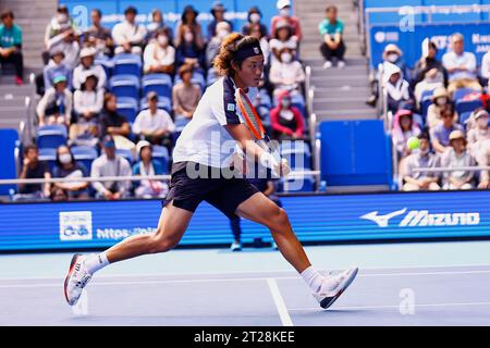 Tokyo, Japan. 18th Oct, 2023. Zhizhen ZHANG (CHN) hits a reverse against Hubert HURKACZ (POL) during their singles match on the third day of the Kinoshita Group Japan Open Tennis Championships 2023 at the Ariake Coliseum. This is the longest-running ATP Tour tournament in Asia, first held in 1972. The tournament runs from October 16 to 22. (Credit Image: © Rodrigo Reyes Marin/ZUMA Press Wire) EDITORIAL USAGE ONLY! Not for Commercial USAGE! Stock Photo