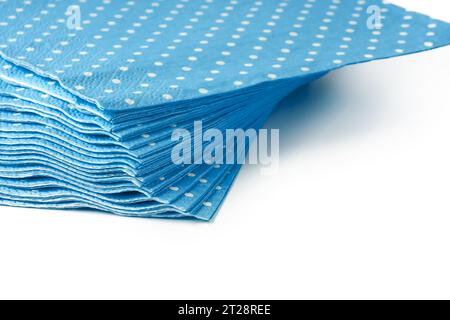 Stack of blue dotted paper napkins isolated on white Stock Photo