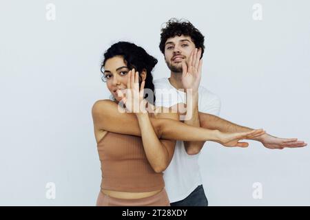 gymnastics, meditation, asana, lotus pose, man and woman doing yoga exercises Stock Photo