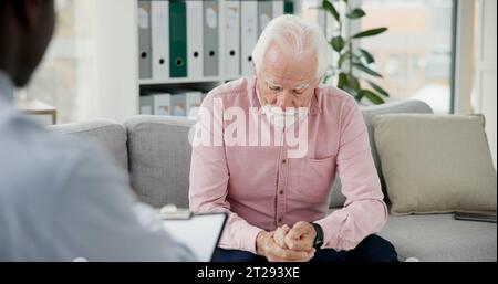 Psychologist, counselling or old man consulting in therapy for depression or support in consultation. Stress, psychology or sad elderly patient Stock Photo