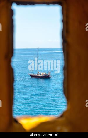 Looking out from the yellow watchtower at the Forte de Sao Tiago fort in Funchal by the sea. Madeira Stock Photo