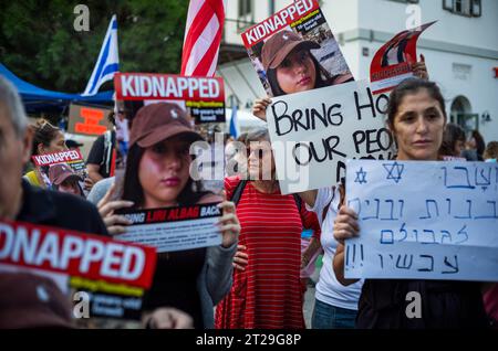 Tel Aviv, Israel. 18th Oct, 2023. Families and their supporters protest in front of the Kiriya military base, displaying photos of their kidnapped relatives. Credit: Ilia Yefimovich/dpa/Alamy Live News Stock Photo