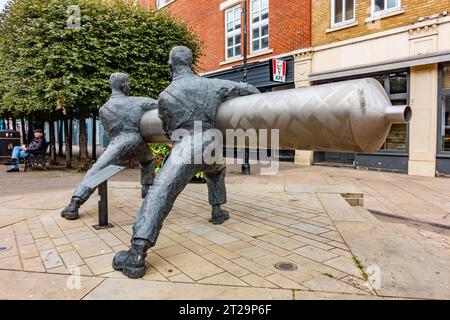 'Roll out the Lino' is a sculpture by David Annand and stand in The High Street in Staines-upon-Thames in Surrey, UK Stock Photo