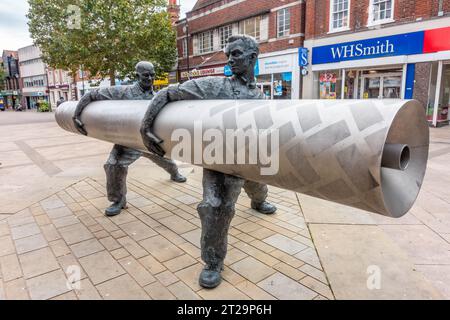 'Roll out the Lino' is a sculpture by David Annand and stand in The High Street in Staines-upon-Thames in Surrey, UK Stock Photo