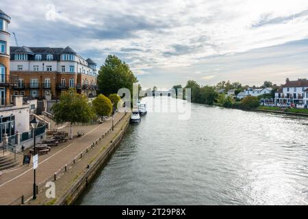 A view down The River Thames taken from Staines Bridge in Staines-upon-Thames in Surrey, UK. Stock Photo