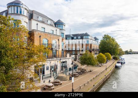 A view down The River Thames taken from Staines Bridge in Staines-upon-Thames in Surrey, UK. Stock Photo