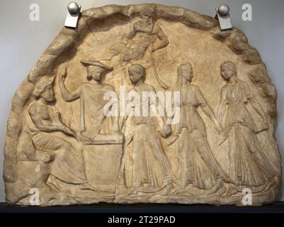 Inscribed votive relief. Archaistic work from the Hellenistic period. Pentilic marble. Barracco Museum of Antique Sculpture. Rome. Italy. Stock Photo