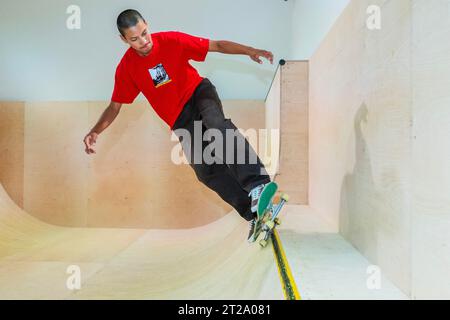 London UK. 18th Oct 2023. London s newest public skate ramp built inside the exhibition gallery with members of the Converse CONS Skateboard Team Riders Skateboard exhibition at the Design Museum. The