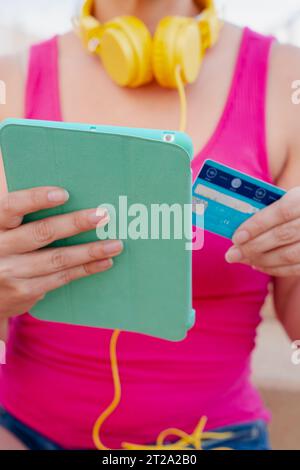 Unrecognizable young woman with credit card and tablet Stock Photo