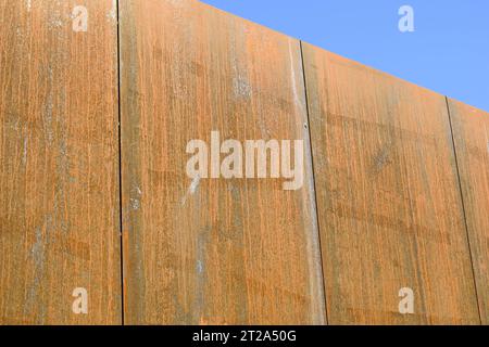 Rusty surface of weathering steel facade panels on the exterior of a building Stock Photo