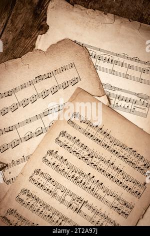 Old Music Sheets On Wooden Background Stock Photo