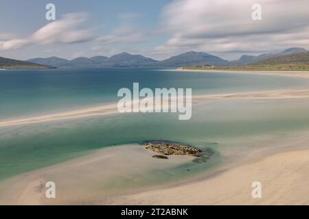 Luskentyre Sands in Isle of Harris is one of the most beautiful beaches in the world, with white sand and turquoise water. Stock Photo