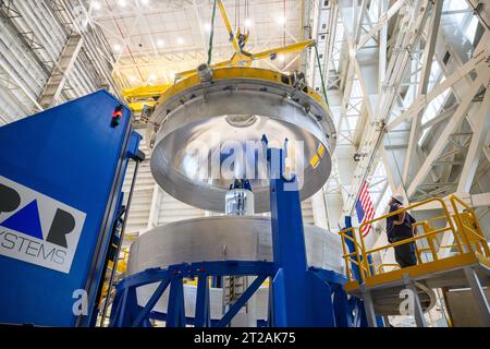 . These images and videos show technicians at NASA’s Michoud Assembly Facility in New Orleans lifting and installing the liquid oxygen dome weld confidence article for a future upper stage for NASA’s SLS (Space Launch System) rocket onto the LTAC (LOX Tank Assembly Center) in Building 115 at Michoud for the next phase of manufacturing in July 2023.  The dome makes up a portion of the liquid oxygen tank weld confidence article for the EUS (exploration upper stage). Teams use weld confidence articles to verify welding procedures and structural integrity of the welds to manufacture structural tes Stock Photo