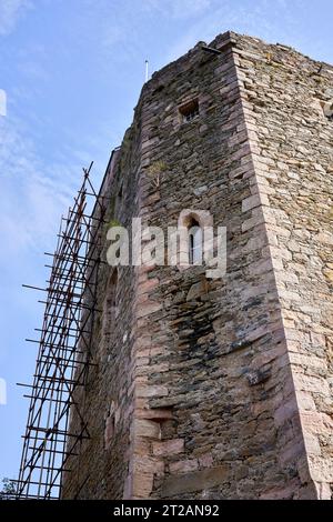 Cloaked with scaffolding, on going repairs and maintenance to historic Carrick Castle on the shore of Loch Goil. Argyll Stock Photo