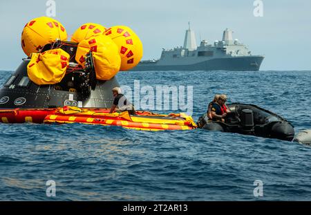 Navy divers from EOD Expeditionary Support Unit 1 secure the Orion Crew ...
