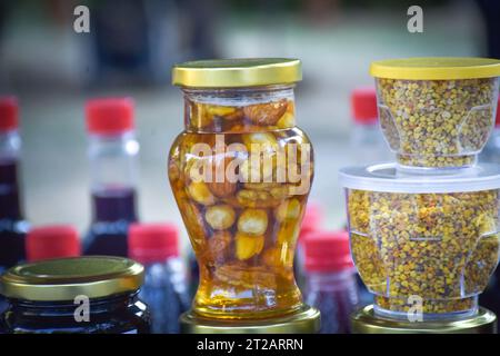 Jars with different kinds of fruit and vegetable juices in market. Berovo, Macedonia Stock Photo