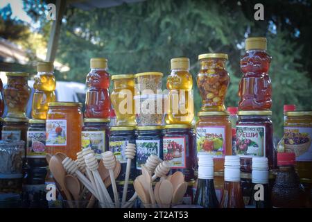 Jars with different kinds of fruit and vegetable juices in market. Berovo, Macedonia Stock Photo