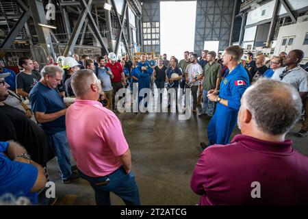 Artemis II Crew with EGS. Artemis II NASA astronaut Reid Weisman, in the center, and Jeremy Hanson, at right, CSA (Canadian Space Agency) Artemis II astronaut, talk with members of the Exploration Ground Systems team inside the transfer aisle of the Vehicle Assembly Building during a visit to the agency’s Kennedy Space Center in Florida on Aug. 7, 2023. The approximately 10-day Artemis II flight will test NASA’s foundational human deep space exploration capabilities, the Space Launch System rocket and Orion spacecraft, for the first time with astronauts and will pave the way for lunar surface Stock Photo