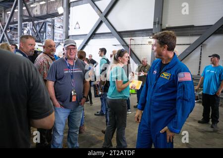 Artemis II Crew with EGS. Artemis II NASA astronaut Reid Weisman greets Exploration Ground Systems team members inside the transfer aisle of the Vehicle Assembly Building during a visit to the agency’s Kennedy Space Center in Florida on Aug. 7, 2023. The approximately 10-day Artemis II flight will test NASA’s foundational human deep space exploration capabilities, the Space Launch System rocket and Orion spacecraft, for the first time with astronauts and will pave the way for lunar surface missions, including landing the first woman and the first person of color on the Moon. Stock Photo