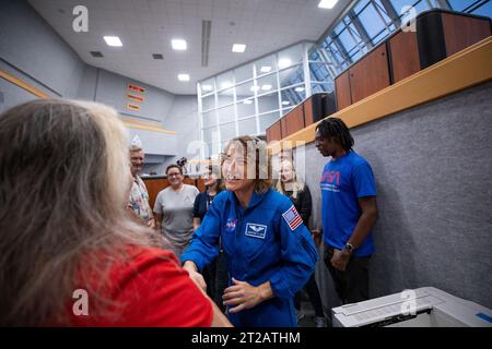 Artemis II Crew with EGS. Artemis II NASA astronaut Christina Koch greets members of the Artemis launch team inside Firing Room 1 in the Launch Control at NASA’s Kennedy Space Center in Florida on Aug. 7, 2023. Koch and fellow Artemis II astronauts Victor Glover, Reid Weisman, and CSA (Canadian Space Agency) astronaut Jeremy Hanson are at the center to meet workers and tour facilities. The approximately 10-day Artemis II flight will test NASA’s foundational human deep space exploration capabilities, the Space Launch System rocket and Orion spacecraft, for the first time with astronauts and wil Stock Photo