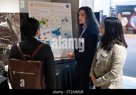 2023 DEVELOP Day. Students and young professionals discuss their projects during the 2023 DEVELOP Day, Wednesday, Aug. 9, 2023, at the Mary W. Jackson NASA Headquarters building in Washington. Every summer students and young professionals from NASA’s Applied Sciences’ DEVELOP National Program come to NASA Headquarters to present their research. This year marks the 25th year of DEVELOP, a training and development program where students work on Earth science research projects, mentored by science advisors from NASA and partner agencies, and extend research results to local communities. Stock Photo