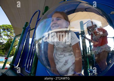 KSC Child Development Center (CDC) Playground Ribbon Cutting. Children enjoy a brand new playground at Kennedy Space Center’s Child Development Center on Aug. 10, 2023. The playground officially opened following a ribbon cutting ceremony earlier in the day. Stock Photo