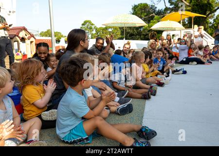 KSC Child Development Center (CDC) Playground Ribbon Cutting. Children anxiously anticipate the opening of a new playground at Kennedy Space Center’s Child Development Center on Aug. 10, 2023. The kids were able to enjoy the playground immediately following a ribbon cutting ceremony. Stock Photo