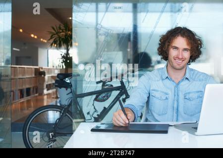 Business man, sketch tablet and laptop for website design, online illustration and planning in office portrait. Young graphic designer or artist on Stock Photo