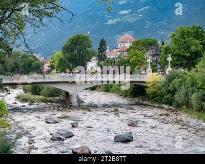 Merano, Italy - 8 August 2023:View of the promenade on the Passirio river in Merano Stock Photo