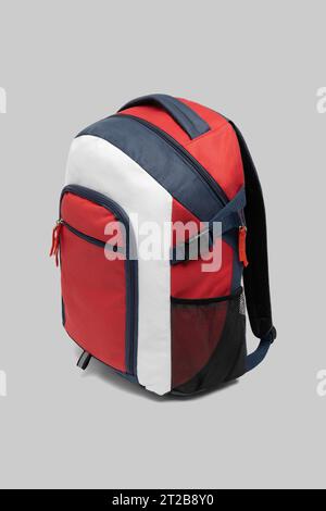 close up trendy fashionable school backpack red and white color isolated on white background with clipping path. side view shoulder strap bag. Stock Photo