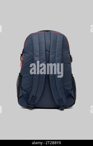 close up trendy fashionable school backpack red and white color isolated on white background with clipping path. back view shoulder strap bag. Stock Photo