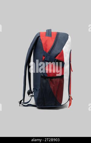close up trendy fashionable school backpack red and white color isolated on white background with clipping path. side view shoulder strap bag. Stock Photo