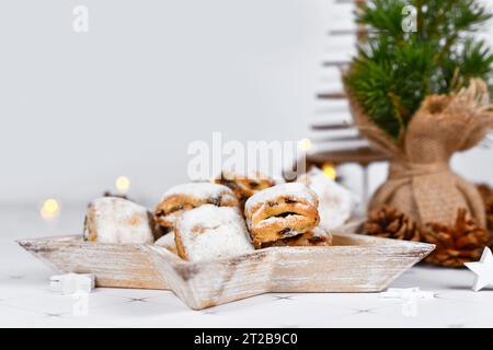 German Stollen cake pieces, a fruit bread with nuts, spices, and dried fruits with powdered sugar traditionally served during Christmas time Stock Photo